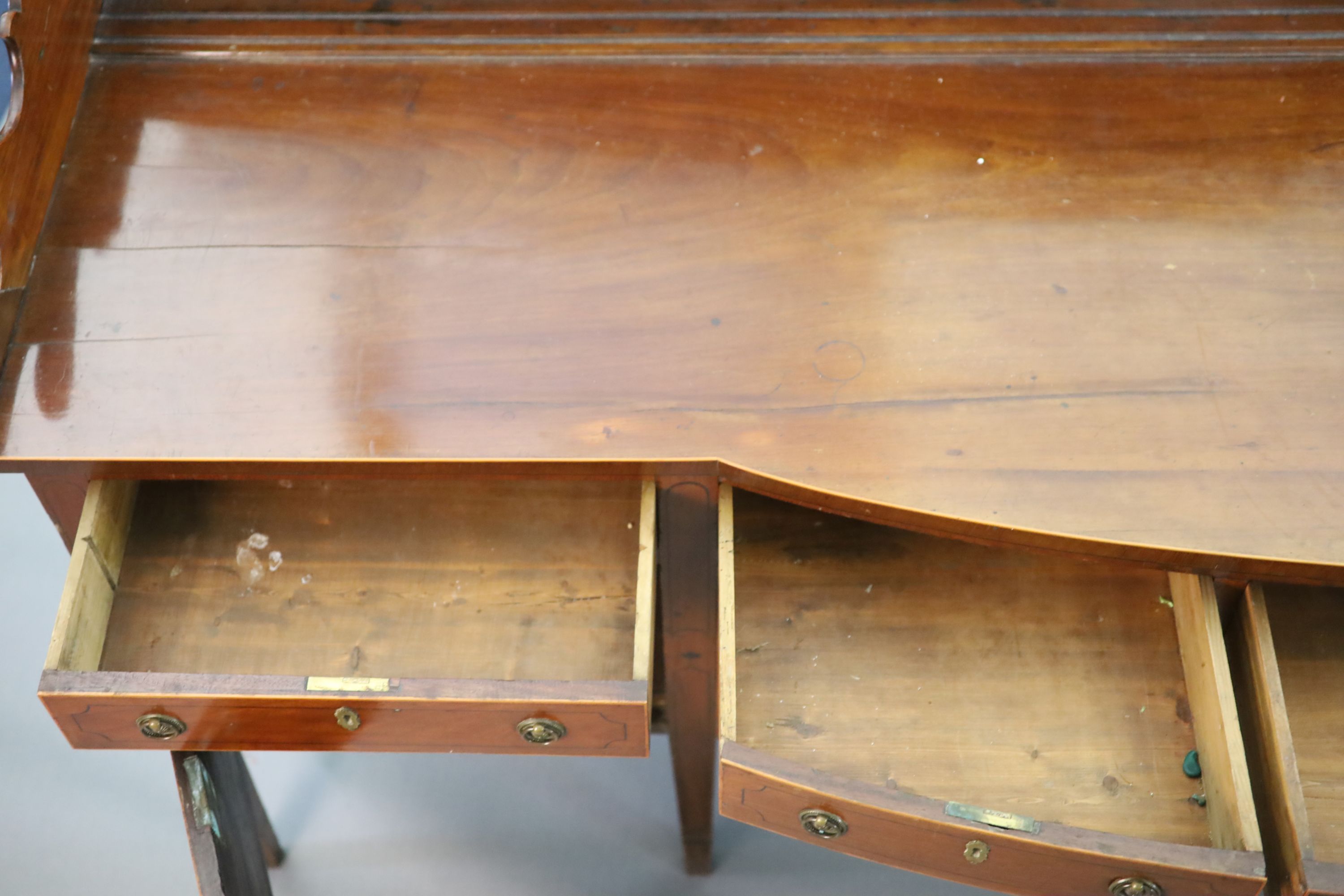 A Regency boxwood strung mahogany bowfront sideboard, W.241cm D.63cm H.118cm